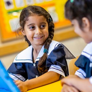 student in the classroom working with a smart tablet