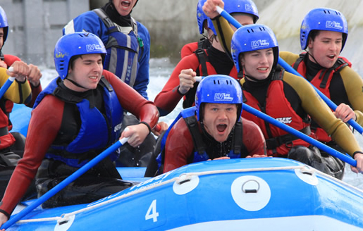 group of students in a white water raft