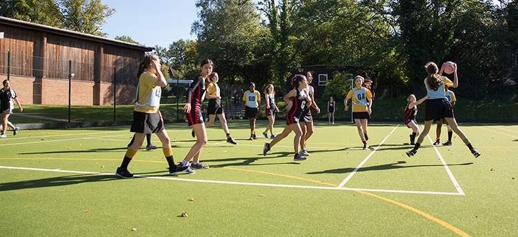 students playing on the netball turf