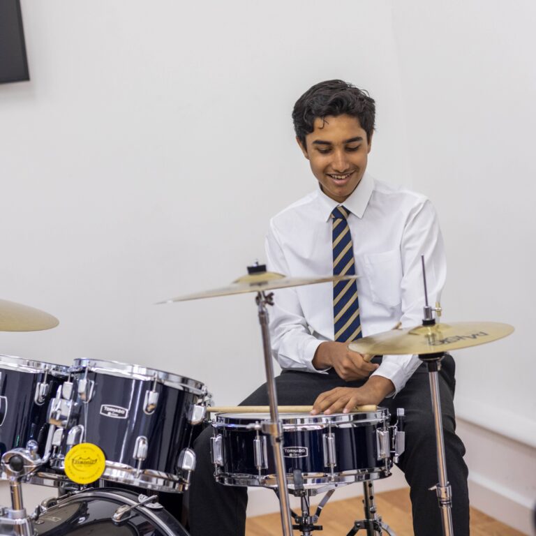 boy playing drums