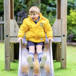 boy going down a slide