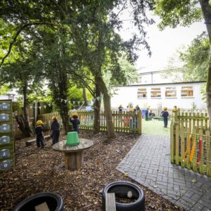 Outside of the school with children playing