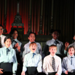 children singing in a carol concert