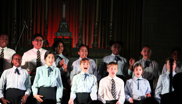 children singing in a carol concert