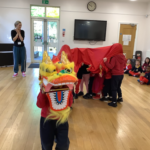 children leading a Chinese New Year show