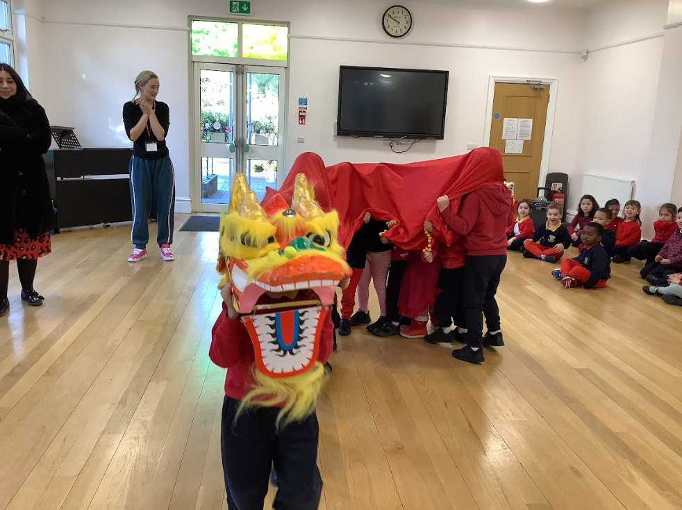 children leading a Chinese New Year show