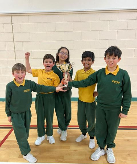 children holding a trophy