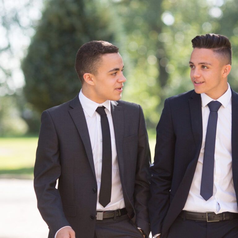 2 student boys walking