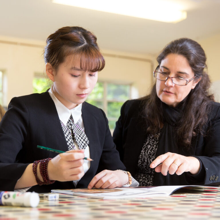 a teacher helping a student