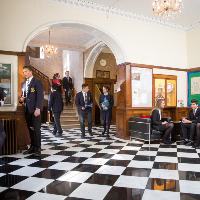 students walking around the common room and hallway