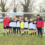 boys in front of a goal