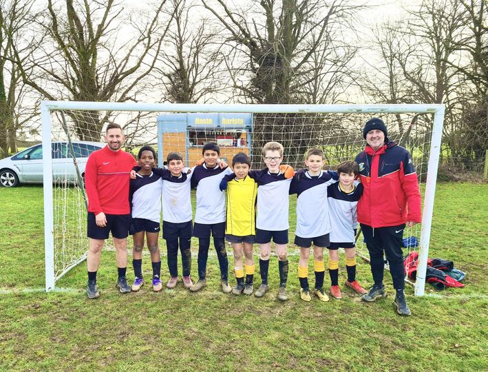 boys in front of a goal