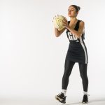 student holding a netball