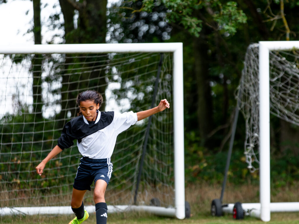 school student playing football