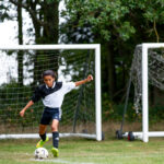 school student playing football