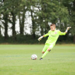 boy kicking a ball