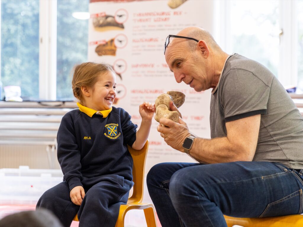student touching a bone