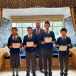 students holding certificates