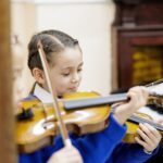 student playing the violin