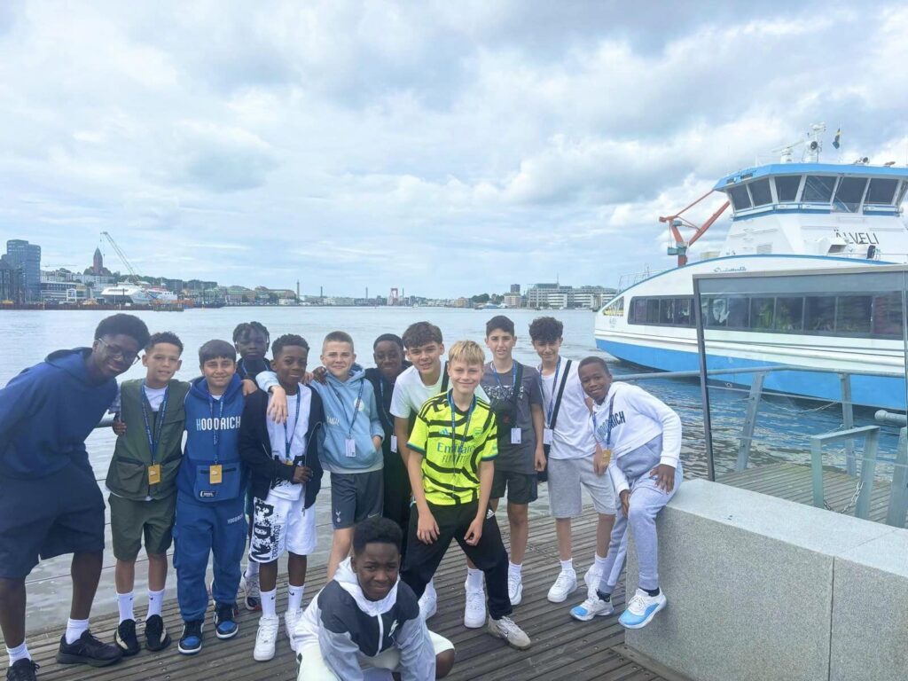 group of boys by the pier